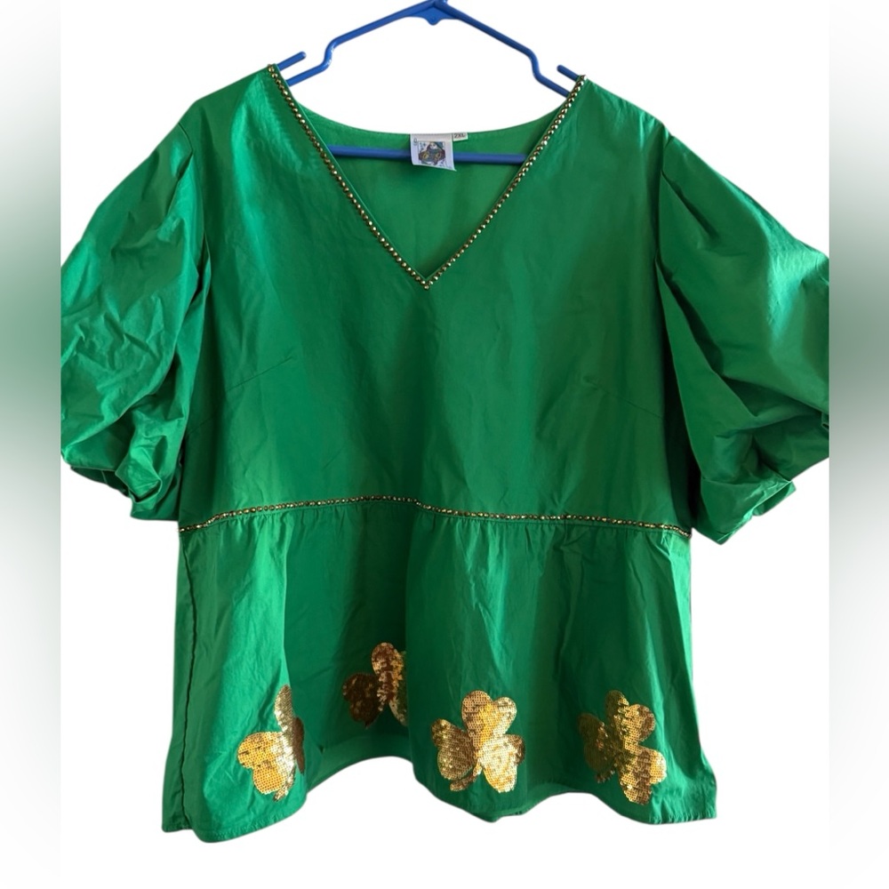 Queen of Sparkles darling green St Pats. I wear a lg/xl and it fits me so cute.